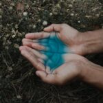 human hand with blue liquid